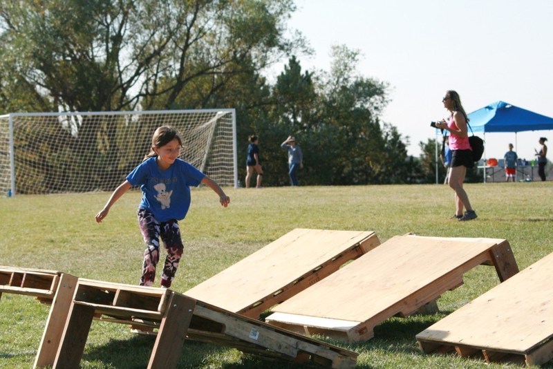 child running obstacle course on school field