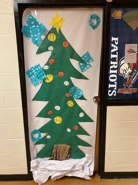 a door decorated with a Christmas tree and baseballs