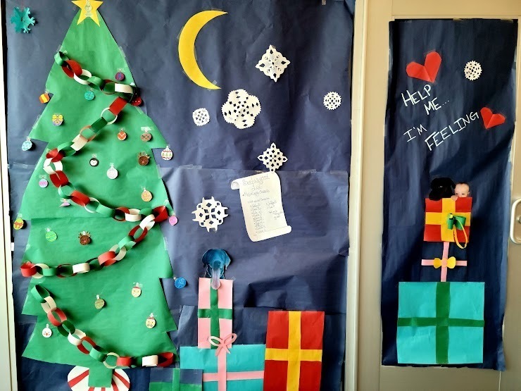 photos of classroom doors decorated for Christmas
