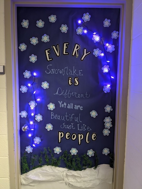 a door decorated with snowflakes saying every snowflae is different yet all are beautiful  just like people
