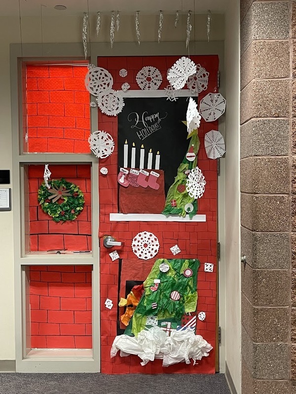 a door decorated like a chimney for Christmas