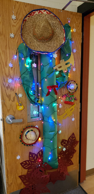 door decorated with cactus, sombreros, and musical instruments