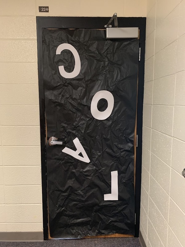 door decorated to look like coal and it says coal