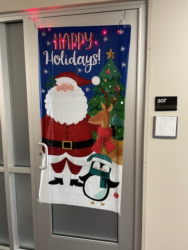 door decorated with Santa, reindeer and penguin
