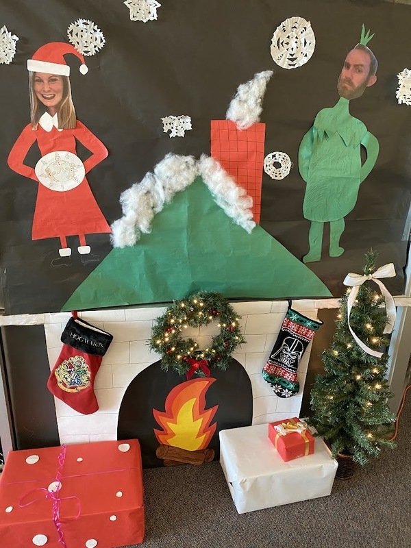 door decorated as a fireplace and chimney for Christmas