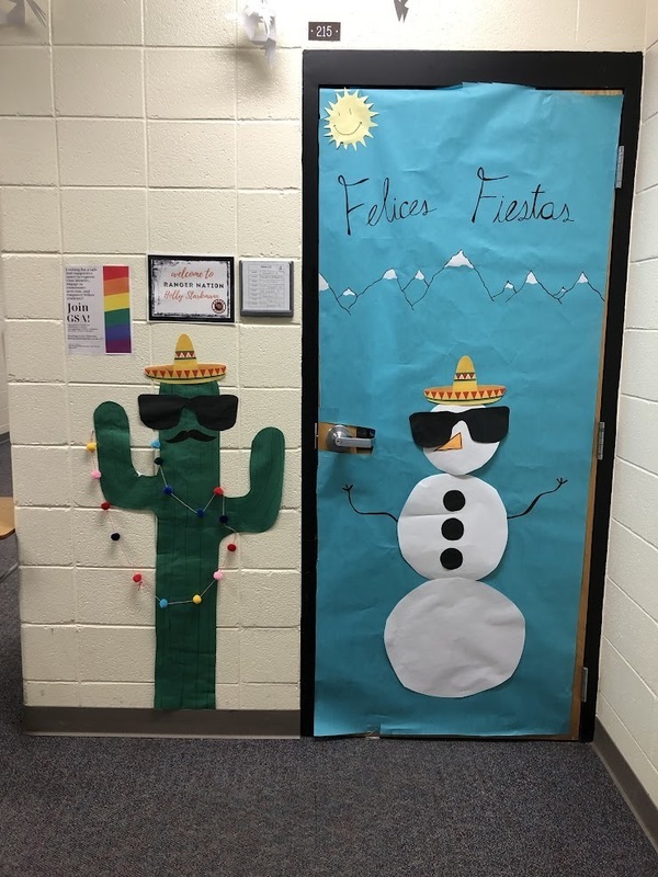 door decorated with snowman and cactus saying Felices Fiestas