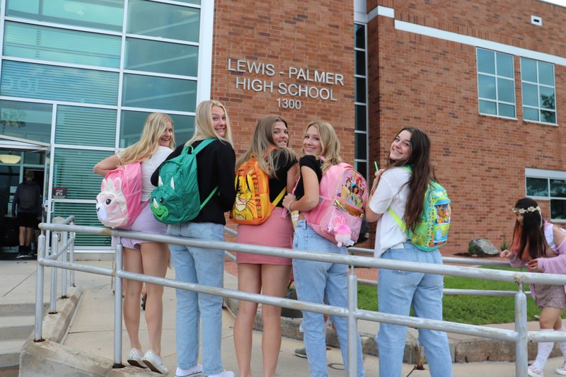 Students with backpacks at front door of LPHS on first day of school